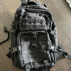 Black tactical backpack similar to 5.11
